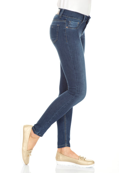 Woman Wearing Denim Tight Jeans with gold flat shoes