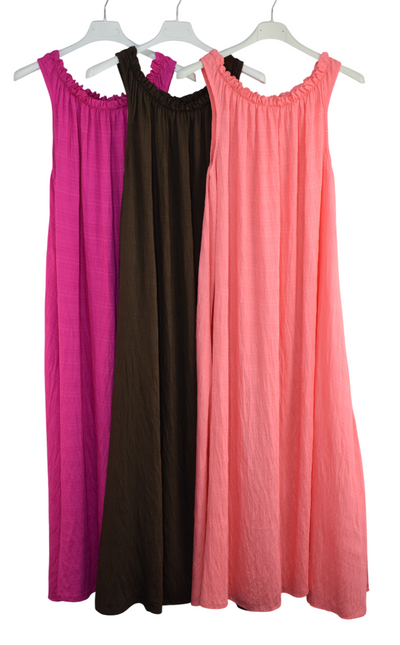 Three long dresses in pink, black, and coral on hangers against a white background.